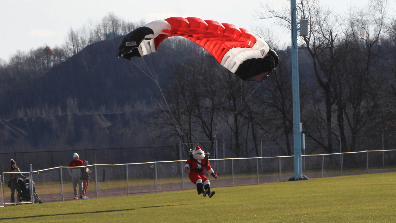 skydiving Santa Claus makes an entrance at Veterans Memorial Stadium in Shenandoah