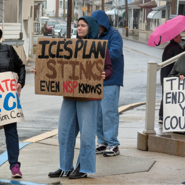 Alyssa Hatter, of Tremont, holds a sign expressing her opposition to the proposed ICE detention center in Tremont Township.